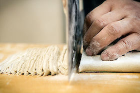 A soba master cuts noodles, Sado Island, Japan | © Matt Giraud Photography
