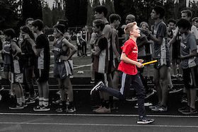 Racing past the crowd in the middle leg of a 3x800. | © Matt Giraud Photography